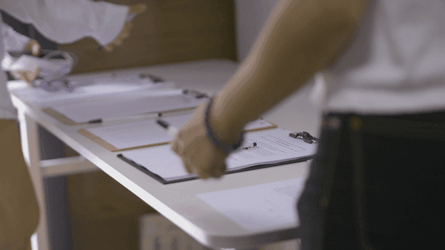People working with documents on a table