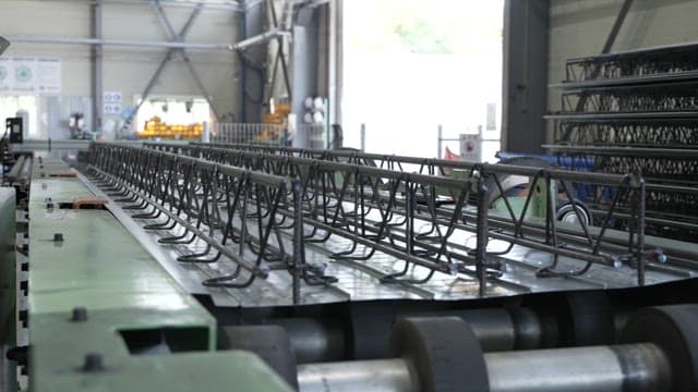 Metal sheets being processed in a factory