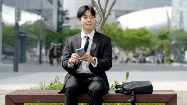 Happy looking office worker after receiving a business call