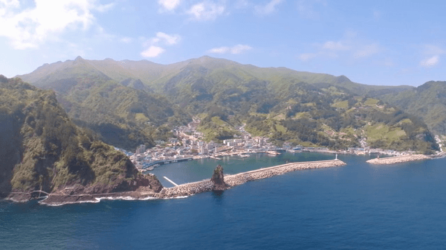 Coastal town with mountains and sea