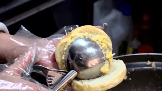 Preparing egg salad for a sandwich