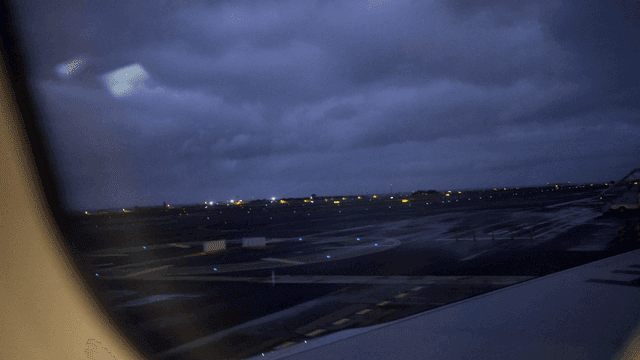 Night view of airport runway from airplane