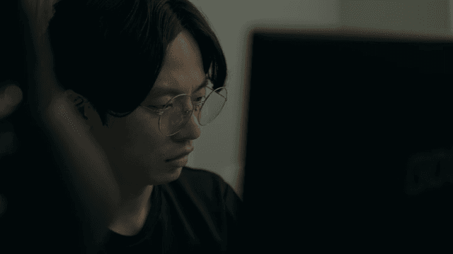Man working intently on a computer