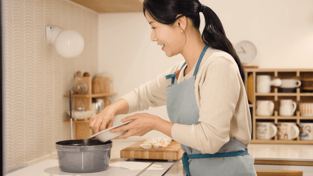 Woman cooking in home kitchen