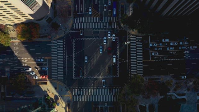 Busy city intersection with moving cars