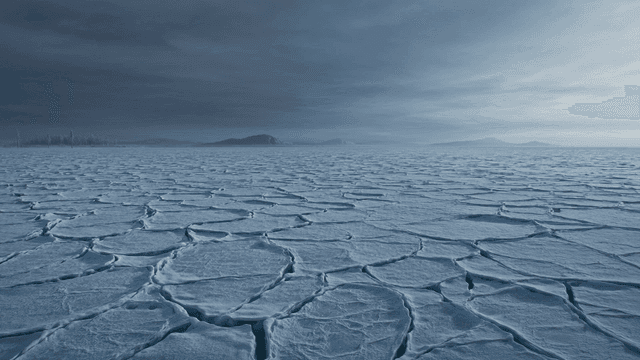 Vast, frozen landscape beneath cloudy sky