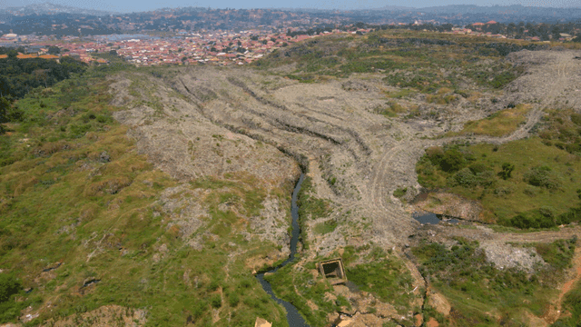 Vast village landscape with green hills