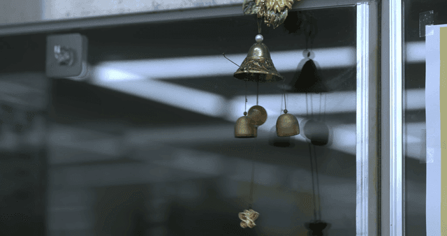 Decorative bell hanging on door