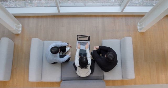 Overhead View of a Business Meeting with Laptop