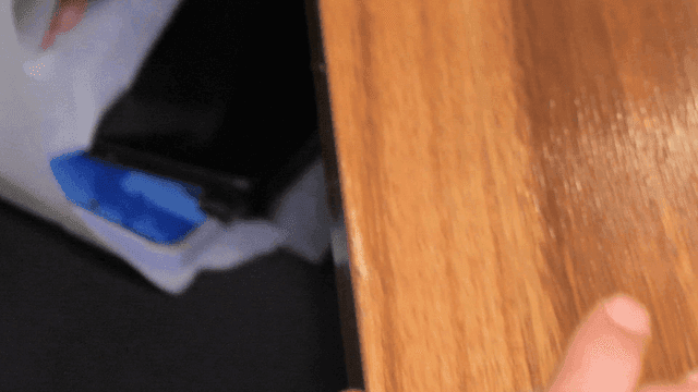 Hands clasped together on a table