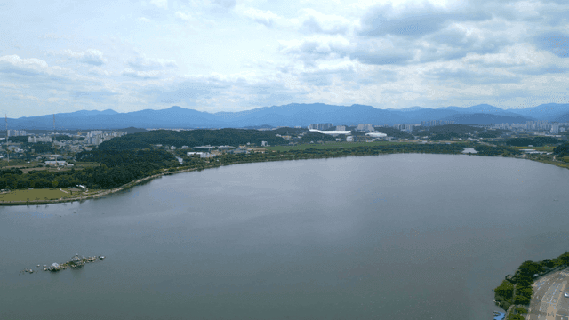 Wide lake under cloudy sky
