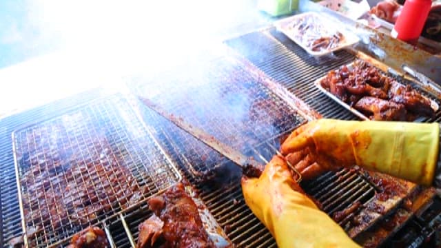 Seasoned pig's feet grilled on a grill