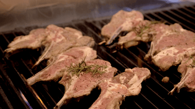 Lamb ribs grilling hot on grill