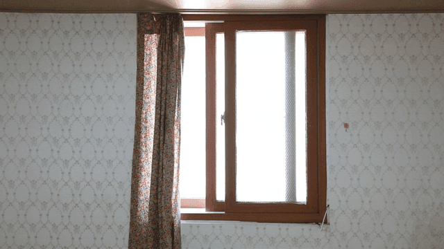 Window with floral curtains in a room