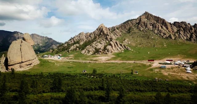 Scenic mountain landscape with yurts