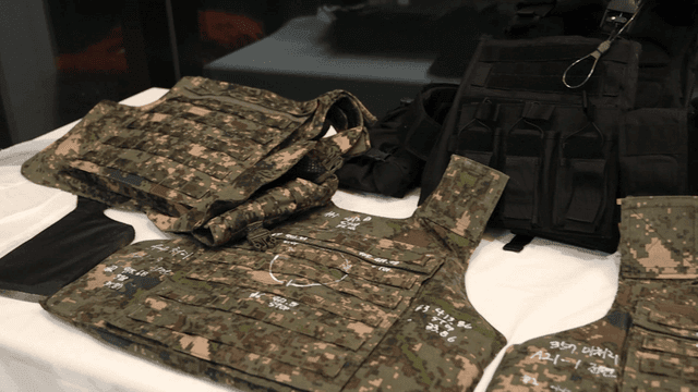 Military gear displayed on a table