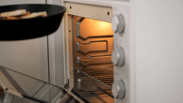 Pan with ratatouille placed in oven