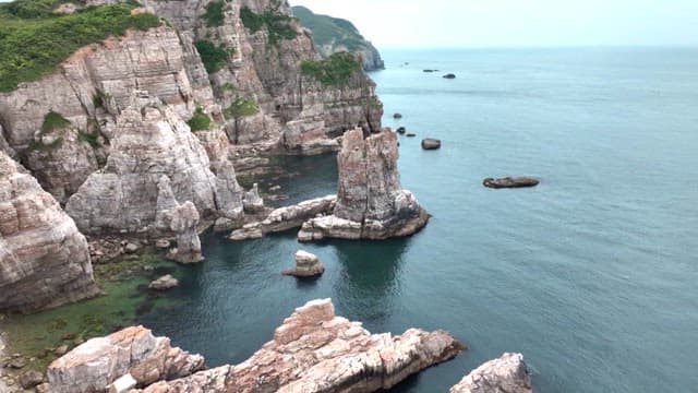 Rugged coastal cliffs overlooking a calm sea