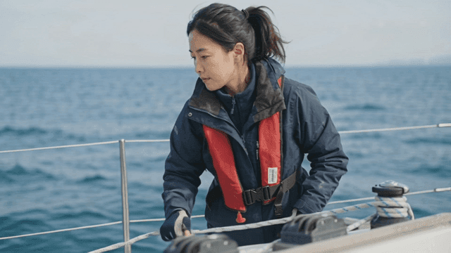 Woman sailing on a yacht in the ocean