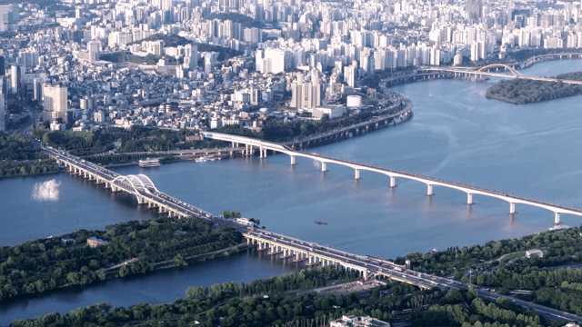 Aerial view of a city with bridges and river