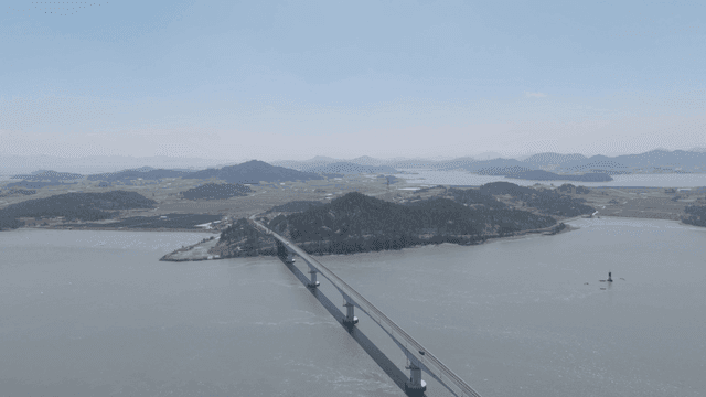 Bridge connecting islands on calm sea