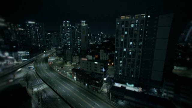 Crowded Traffic and Facades of Apartments in the City at Night