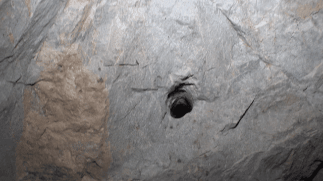 Close-up view of a rocky cave wall
