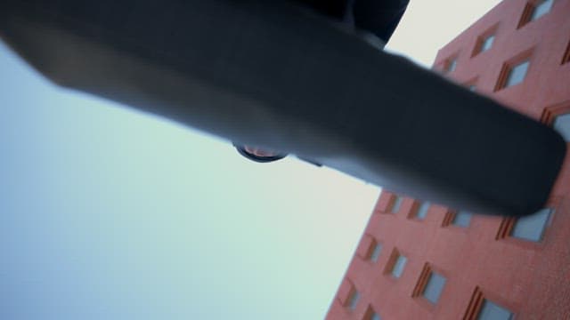 Man with a briefcase entering the red building