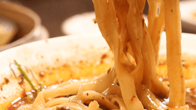Chopsticks lifting spicy dosamyeon