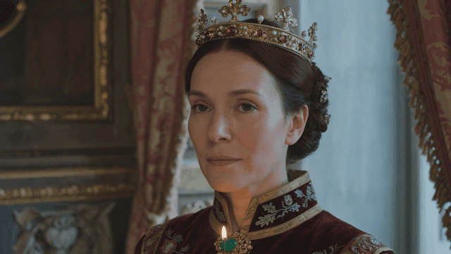 Woman wearing crown and royal attire