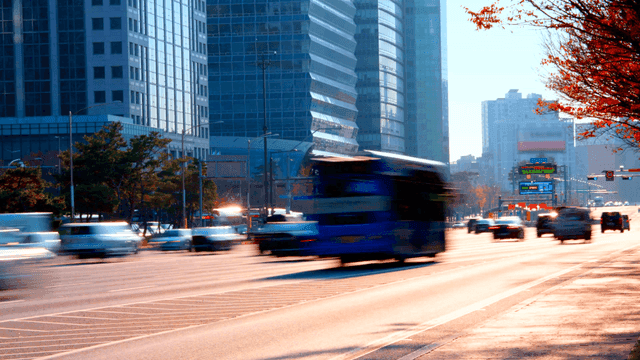 Busy city road with moving vehicles
