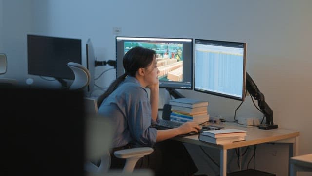 Woman working late at an office desk