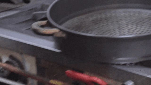 Mixing potatoes and eggs in a large pot