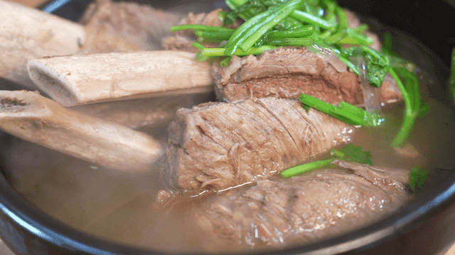 Korean beef rib soup with fresh greens