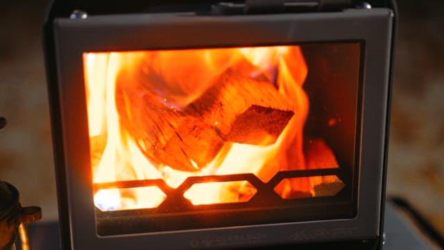 Glowing Firewood in a Cozy Stove