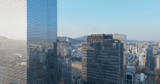 Cityscape with skyscrapers and mountains
