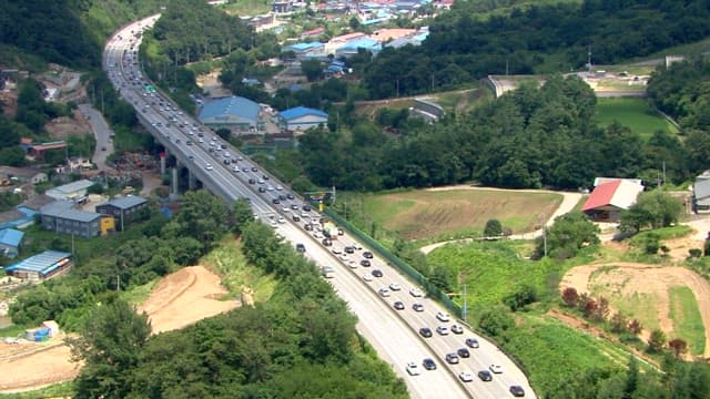 Aerial View of Busy Highway in Urban Area