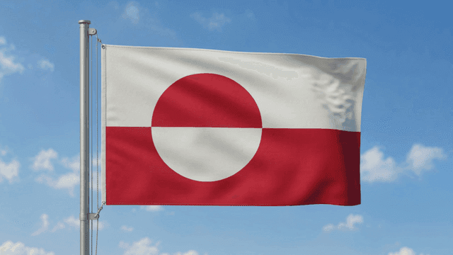Greenland flag fluttering against clear sky