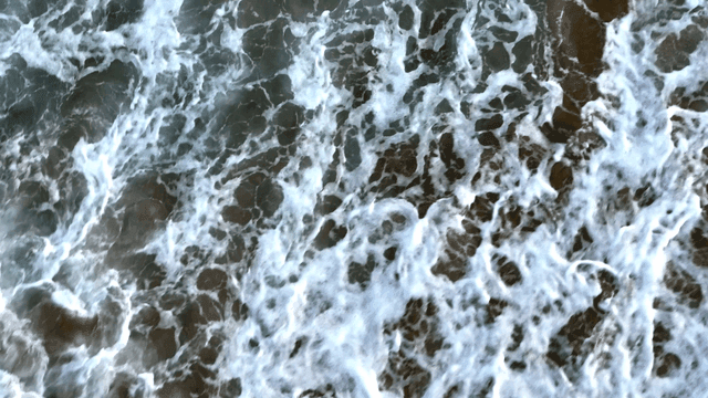 Waves crashing on a sandy beach