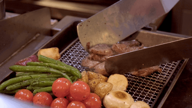 Grilled vegetables and meat on a tray