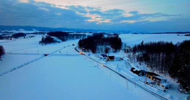 Snow-covered village with twilight skies