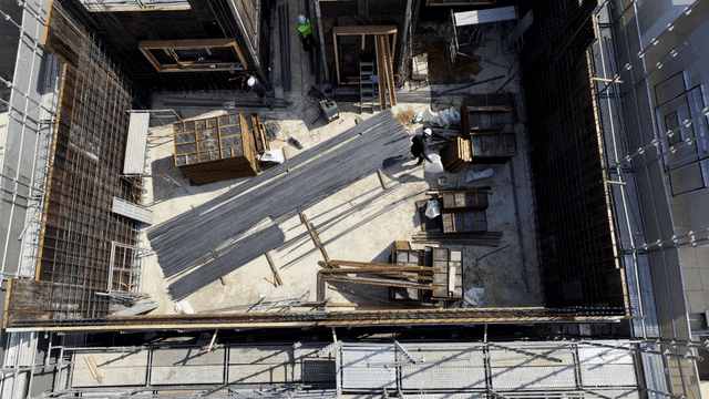 Construction site with workers and materials