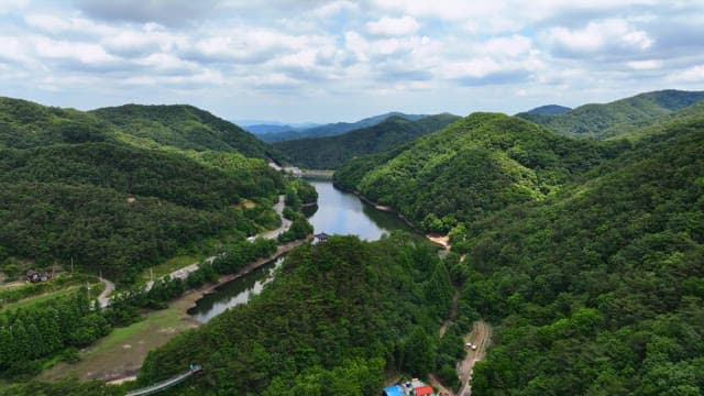 Lush mountains and a serene river