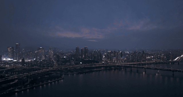 A city skyline at dusk with lights
