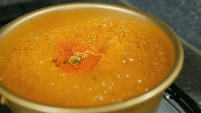 Instant Ramyeon boiling in a pot