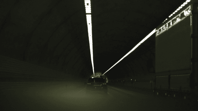 Driving vehicle through dark tunnel
