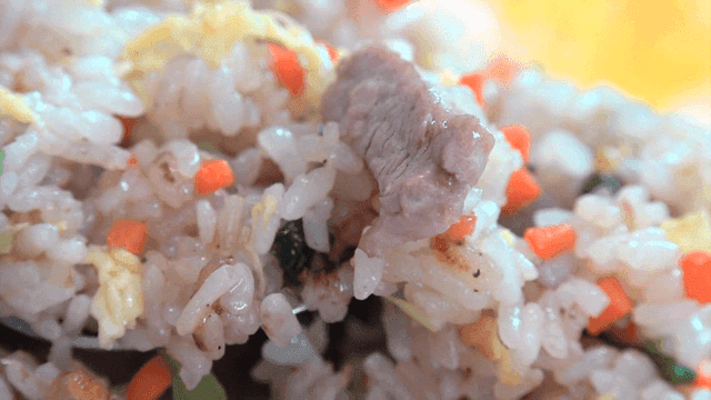 Chinese cuisine fried rice with oily vegetables and meat