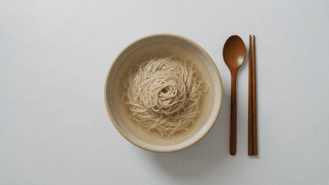 Noodles in bowl and tableware