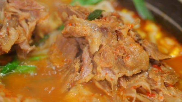 Spicy pork backbone stew boiling in a pot