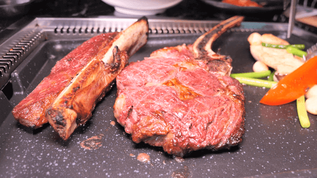 Grilled steak with vegetables on a pan